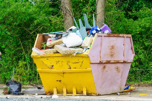 Photograph showing a clearance team at work removing items from a flat